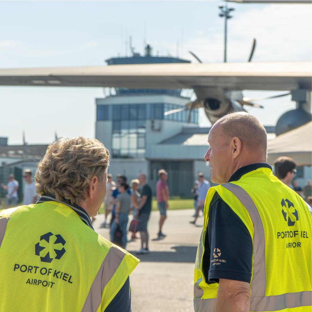 Airport staff looking at event